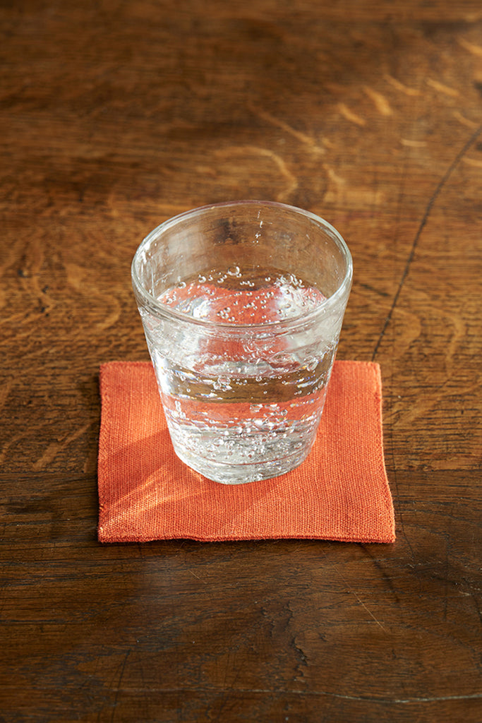 Orange Linen Coaster with drink by Fog Linen at Abacus Row Handmade Jewelry